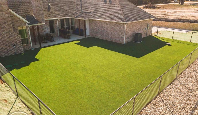 Artificial turf fenced backyard