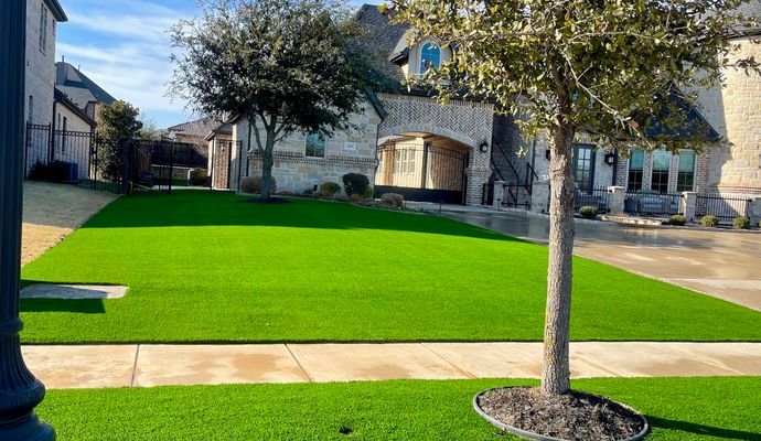 A pristine front yard featuring newly installed artificial turf