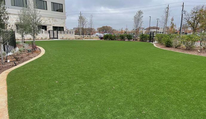 Commercial landscaping with artificial turf surfacing