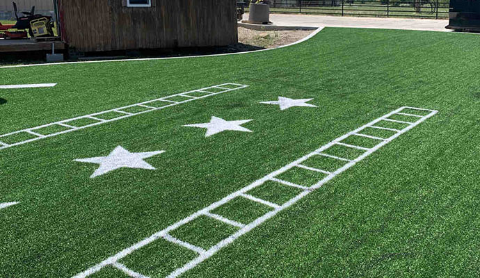 Artificial turf with markings for fitness and agility drills.