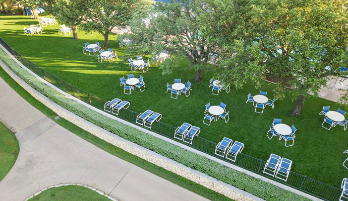 Professional artificial turf installation for country club outdoor seating areas