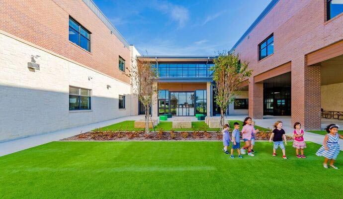 Children playing on durable artificial turf