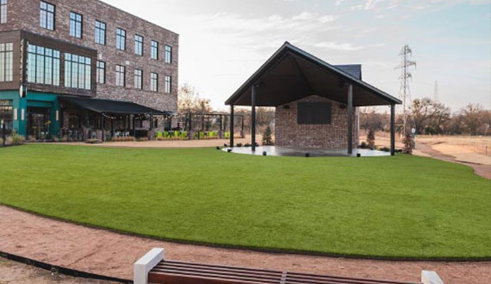 Commercial outdoor event venue with synthetic turf lawn