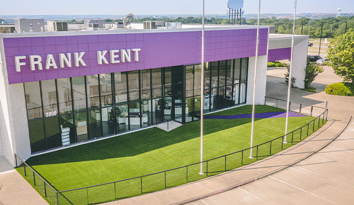 Commercial storefront exterior with synthetic grass lawn
