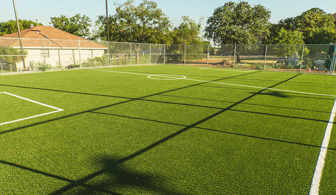 Community soccer field made with artificial turf.