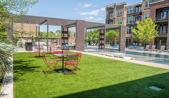 Hotel pool area with installed synthetic turf