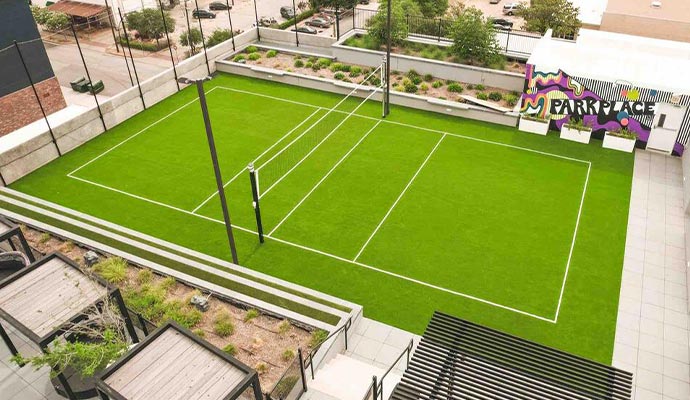 Installed artificial turf for tennis courts near park area