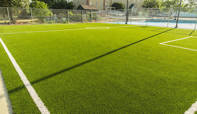 Close-up of a new artificial turf soccer field.