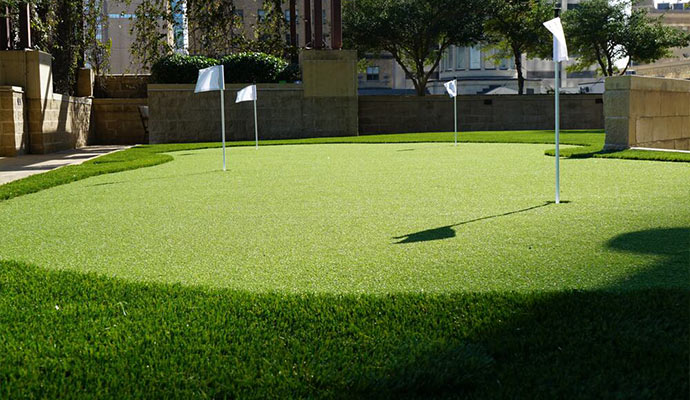 Artificial turf putting green in an urban setting.