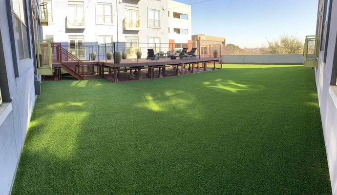 Luxurious rooftop putting green with synthetic turf