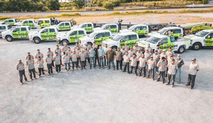 WinterGreen Synthetic Grass team with their service vehicles