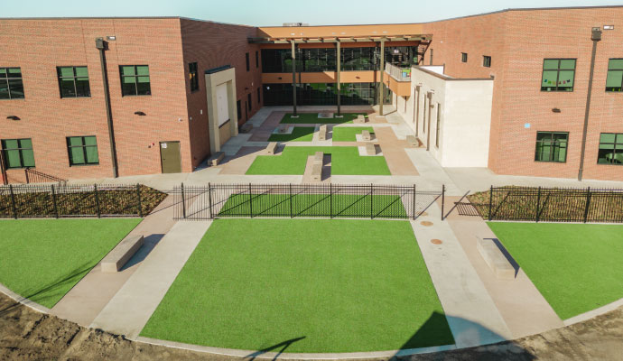 Commercial courtyard with installed green turf