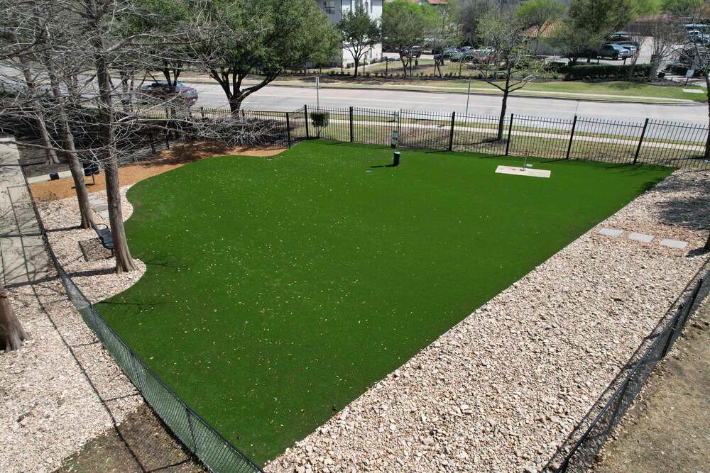 Frisco Apartment Pet Park With Artificial Turf And River Rock