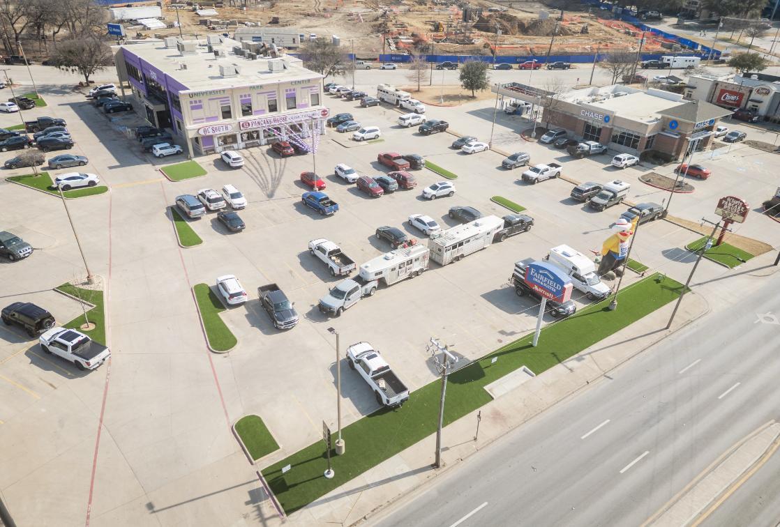 Commercial parking area with artificial grass