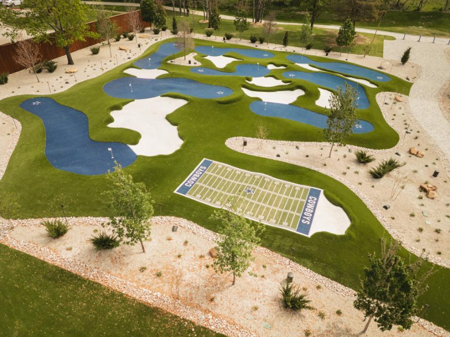 Golf course with artificial grass putting greens