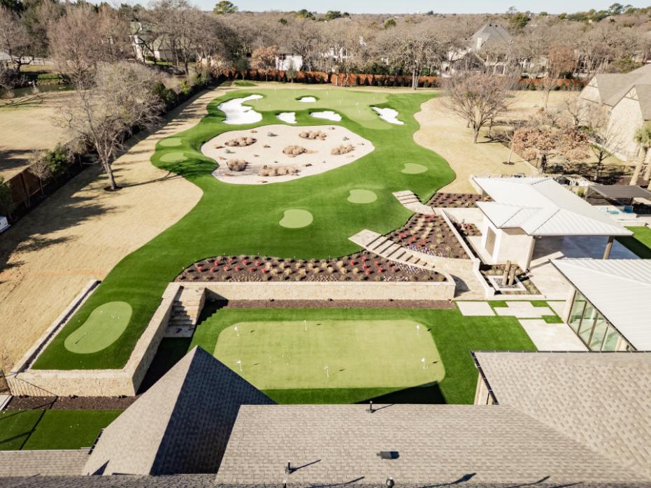 Residential yard with artificial grass golf area