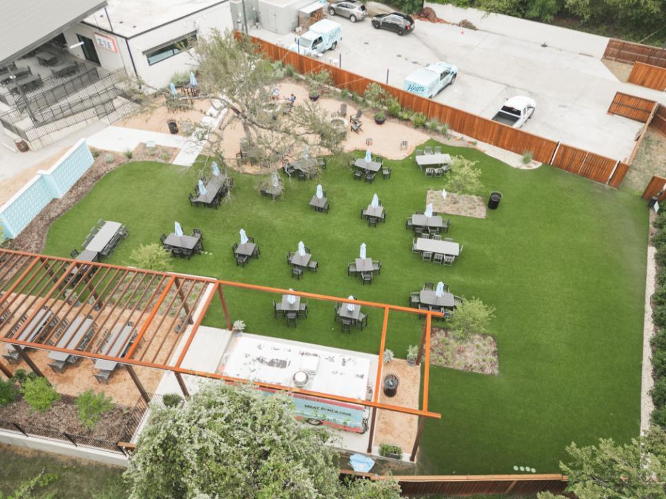Restaurant patio with artificial grass seating area