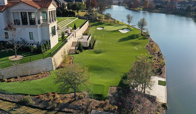 Luxurious lakeside home with synthetic putting green