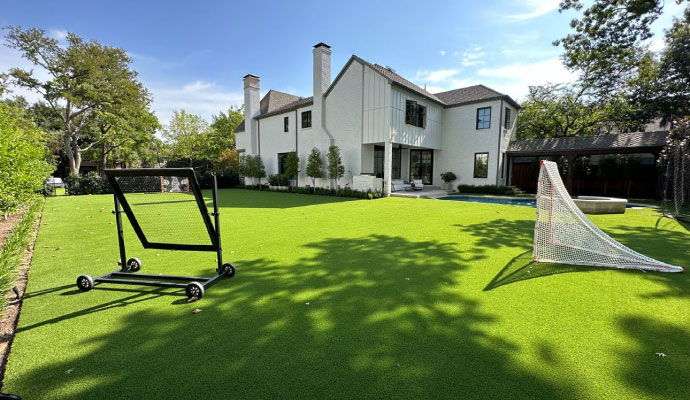 Luxury home with large green backyard lawn
