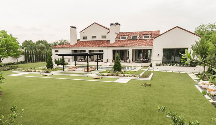 Luxury home backyard with artificial turf and swimming pool