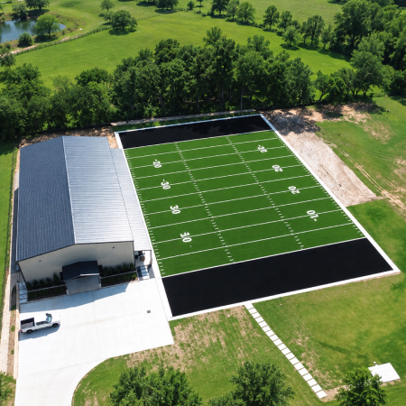 Custom backyard football field with synthetic grass