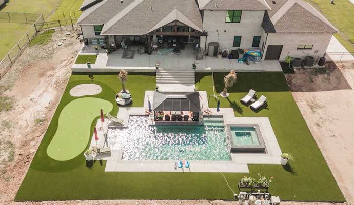 Pool area with installed synthetic grass