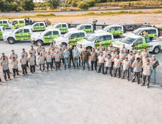 WinterGreen Synthetic Grass team with service vehicle