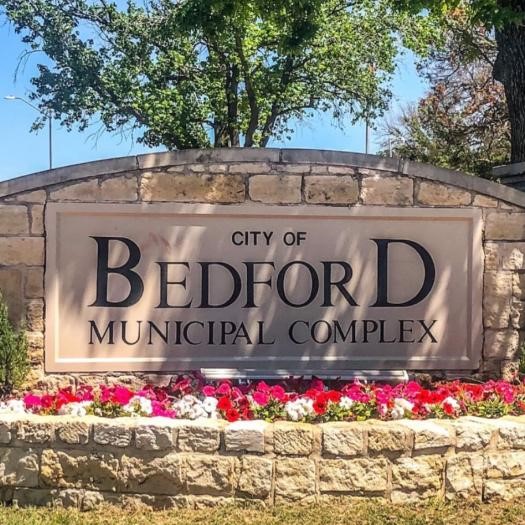 Bedford, Texas municipal complex sign featuring Bedford Artificial Grass in front.